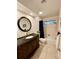 Bathroom featuring a vanity sink, a large mirror, and shower-tub combo at 5350 Barbarossa Ave, Sarasota, FL 34235