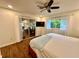Bright bedroom with a ceiling fan, lots of natural light, and a sliding glass door to the adjacent room at 5350 Barbarossa Ave, Sarasota, FL 34235