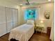 Charming bedroom featuring hardwood floors, a bright atmosphere, and an artwork at 5350 Barbarossa Ave, Sarasota, FL 34235