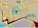 Bedroom featuring a built-in pet door, hardwood floors and natural light at 5350 Barbarossa Ave, Sarasota, FL 34235
