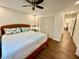 Inviting bedroom with wood floors, a ceiling fan, large closet, and a comfortable queen size bed at 5350 Barbarossa Ave, Sarasota, FL 34235