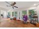 Versatile bonus room with hardwood floors, natural light, and sliding doors to the outside at 5350 Barbarossa Ave, Sarasota, FL 34235