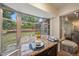 Breakfast nook featuring a large window, seating for two, and view to the backyard at 5350 Barbarossa Ave, Sarasota, FL 34235