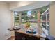 Inviting breakfast nook with a large window offering a view of the backyard at 5350 Barbarossa Ave, Sarasota, FL 34235