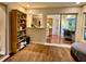 Dining room with hardwood floors, sliding glass doors to the kitchen and views of the backyard at 5350 Barbarossa Ave, Sarasota, FL 34235