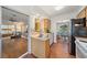 Efficient kitchen featuring a stainless steel sink and appliances with views into the dining room at 5350 Barbarossa Ave, Sarasota, FL 34235