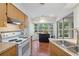Well-lit kitchen with ample counter space and stainless steel appliances at 5350 Barbarossa Ave, Sarasota, FL 34235