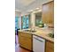 Kitchen features tile floors, stainless steel sink, and white dishwasher at 5350 Barbarossa Ave, Sarasota, FL 34235