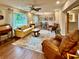 Bright living room with hardwood floors, lots of natural light, and a dining area view at 5350 Barbarossa Ave, Sarasota, FL 34235
