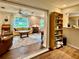 Open concept living room with hardwood floors and view of front room at 5350 Barbarossa Ave, Sarasota, FL 34235