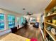 Spacious living room with abundant natural light, hardwood floors and access to backyard at 5350 Barbarossa Ave, Sarasota, FL 34235