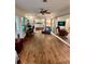 Bright living room with hardwood floors and large windows at 5350 Barbarossa Ave, Sarasota, FL 34235