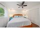 Cozy main bedroom featuring light wood floors and a spacious closet at 5350 Barbarossa Ave, Sarasota, FL 34235