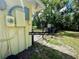 Side yard view, showing a gate leading to the back of the property at 5350 Barbarossa Ave, Sarasota, FL 34235
