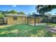 Exterior backyard featuring a covered patio, a well-maintained lawn at 5438 Potter St, Sarasota, FL 34232