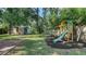 Large backyard featuring play set, lush lawn, shed and privacy fence at 5438 Potter St, Sarasota, FL 34232
