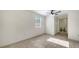 Bright bedroom with tile flooring, ceiling fan, and natural light from the window at 5438 Potter St, Sarasota, FL 34232