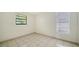 Bedroom featuring tile flooring, natural light from the windows at 5438 Potter St, Sarasota, FL 34232
