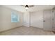 Bedroom with tile flooring, ceiling fan, window and closet at 5438 Potter St, Sarasota, FL 34232