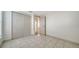 Bedroom featuring tile flooring, closet and entry door at 5438 Potter St, Sarasota, FL 34232