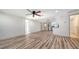 Open concept living space leading to the kitchen featuring stainless steel appliances, and a side door entry at 5438 Potter St, Sarasota, FL 34232