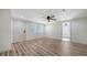 Bright living room featuring a new front door, wood floors, and neutral walls for a clean, modern aesthetic at 5438 Potter St, Sarasota, FL 34232