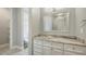 Bathroom featuring marble counters, white cabinets, and modern fixtures at 6050 Saddle Oak Trl, Sarasota, FL 34241