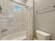 Bathroom featuring a shower and tub combo with decorative tile surround at 6050 Saddle Oak Trl, Sarasota, FL 34241