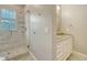 Bathroom with marble tile shower and vanity with double sinks at 6050 Saddle Oak Trl, Sarasota, FL 34241