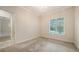 Bedroom with neutral walls, carpet, a chandelier and a window at 6050 Saddle Oak Trl, Sarasota, FL 34241