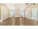 Large bonus room features wood floors, windows with blinds, and recessed lighting at 6050 Saddle Oak Trl, Sarasota, FL 34241