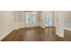 Dining room with hardwood floors, large window and white trim and moldings at 6050 Saddle Oak Trl, Sarasota, FL 34241