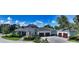 Beautiful residence featuring a three car garage, manicured landscaping, and traditional architectural design at 6050 Saddle Oak Trl, Sarasota, FL 34241