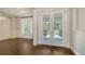 Bright foyer featuring a view of the front yard through double glass doors and an adjacent dining room at 6050 Saddle Oak Trl, Sarasota, FL 34241