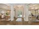 Bright foyer featuring white trim and hardwood floors leads to the dining room, office, and main living area at 6050 Saddle Oak Trl, Sarasota, FL 34241