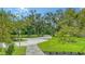 Stone walkway bordered by manicured landscaping, leading up to the main entrance of the beautiful home at 6050 Saddle Oak Trl, Sarasota, FL 34241