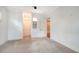 Hallway featuring a storage nook and views into other rooms at 6050 Saddle Oak Trl, Sarasota, FL 34241