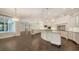 Spacious kitchen with white cabinetry, granite countertops, and open layout at 6050 Saddle Oak Trl, Sarasota, FL 34241