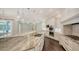 Spacious kitchen with a large island, granite countertops, and stainless steel appliances at 6050 Saddle Oak Trl, Sarasota, FL 34241