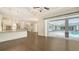 Open floor plan of the living room boasts access to kitchen, lanai, and pool at 6050 Saddle Oak Trl, Sarasota, FL 34241