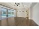 Living room featuring an open floor plan with access to screened in lanai and pool at 6050 Saddle Oak Trl, Sarasota, FL 34241