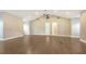 Open living room with hardwood floors, recessed lighting, and high ceilings at 6050 Saddle Oak Trl, Sarasota, FL 34241