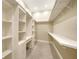 Custom walk-in closet with built in shelving, drawers, and space for a vanity to maximize storage at 6050 Saddle Oak Trl, Sarasota, FL 34241