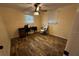 Well lit bedroom with ceiling fan, desk, and ergonomic chair at 611 Missouri Rd, Venice, FL 34293