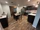 Stylish kitchen with stainless steel appliances, modern countertops, and a cozy dining area at 611 Missouri Rd, Venice, FL 34293