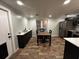 Eat-in kitchen features stainless steel appliances, bar, and ample counter space for food preparation at 611 Missouri Rd, Venice, FL 34293