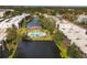 Aerial view of the condo community, showcasing the pool, waterway and lush landscaping at 6188 80Th N St # 102, St Petersburg, FL 33709