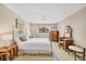 Inviting bedroom provides natural light, neutral colors, and a ceiling fan at 6188 80Th N St # 102, St Petersburg, FL 33709