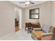 Cozy room with desk, chair, and comfortable armchair near a window and ceiling fan at 6188 80Th N St # 102, St Petersburg, FL 33709