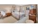 Cozy bedroom boasts natural lighting, neutral walls, and comfortable sleeping space at 6188 80Th N St # 102, St Petersburg, FL 33709